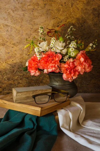 Still life with glasses resting on a book