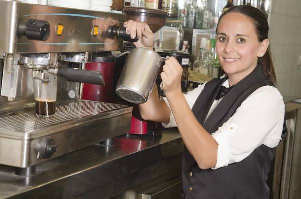 Waitress using coffee machines