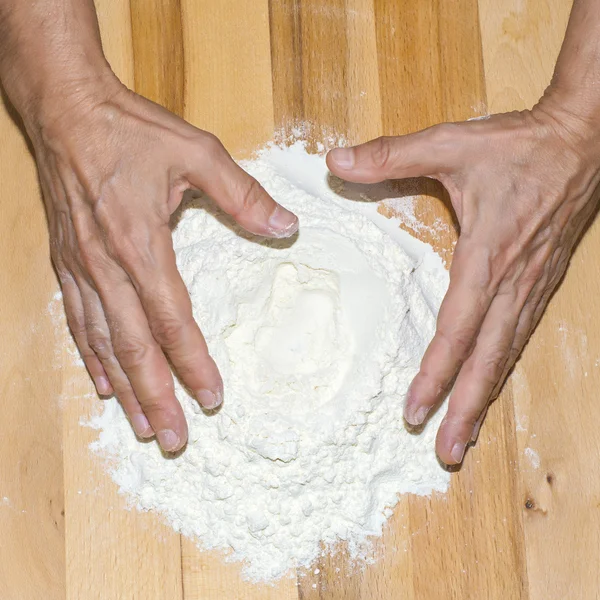 Hands working with flour