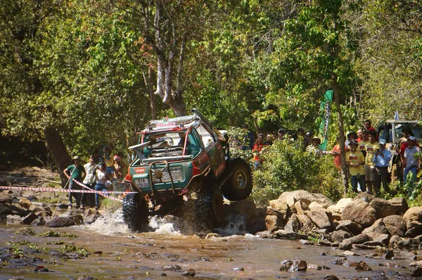 Racer off road at terrain racing car competition