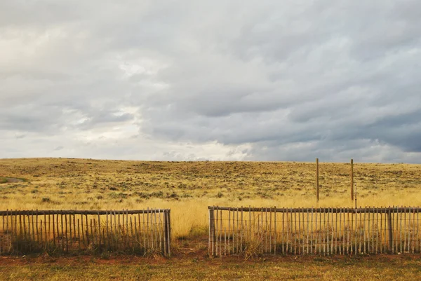 Horizontal photo of landscape of fence and fields, wyoming, usa
