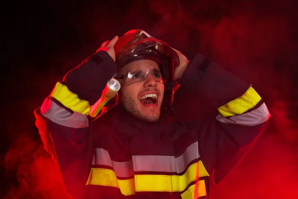 Shocked firefighter in action