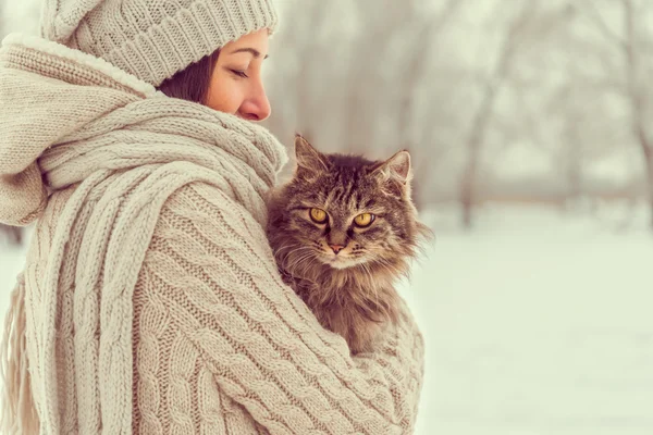 Woman holds cat