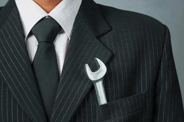 Businessman with spanner