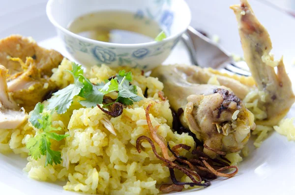 Chicken and Rice Cooked with Yellow Herb