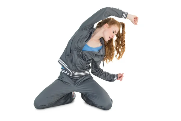 Young woman in sportswear stretching