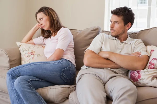 Couple not talking after an argument in living room