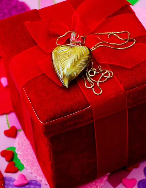 Romantic gift, heart on a chain with a red velvet box