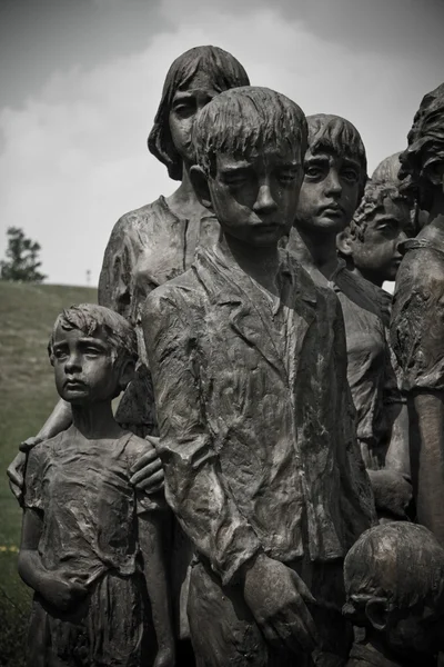 sculpture of sad children from lidice