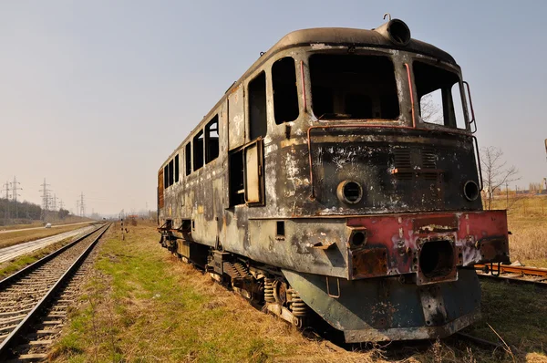 Burnt locomotive on rails