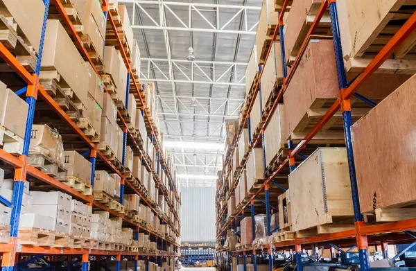 Shelves with boxes in factory warehouse