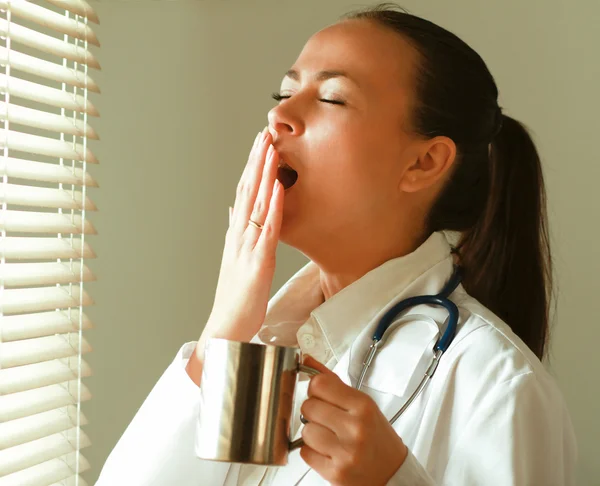 The yawning woman doctor