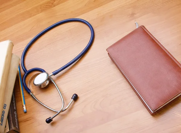 Stethoscope with reference books.