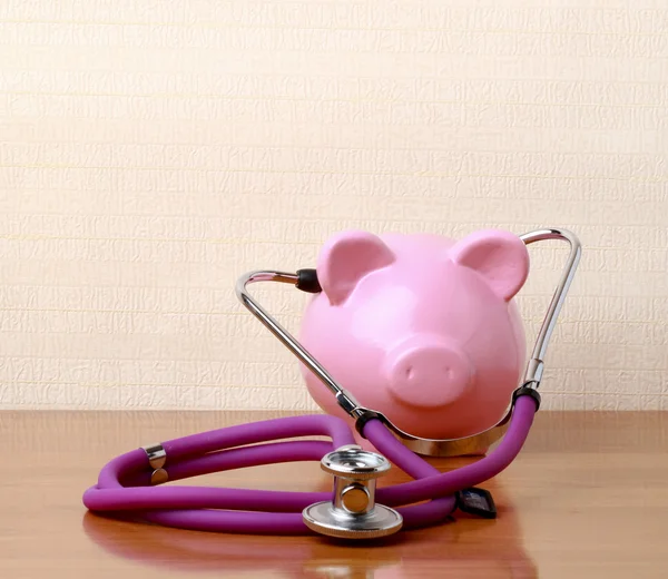 Piggy bank with stethoscope.