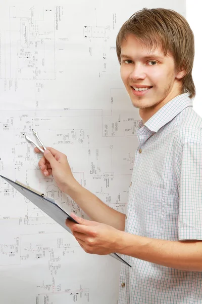 A young man near a diagram