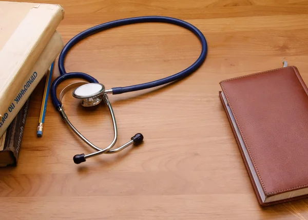 Stethoscope with reference books.