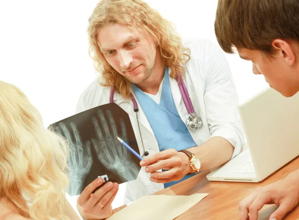 Young couple consulting with doctor