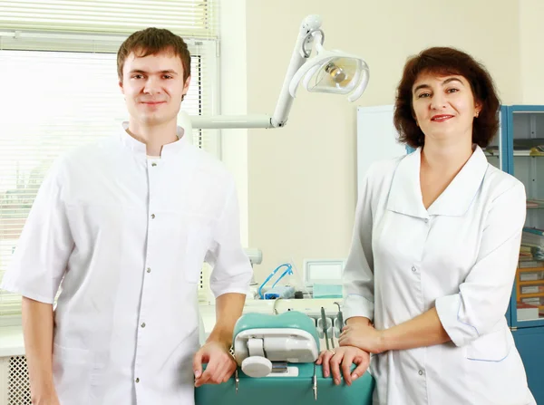 A medical doctors standing in dentist office