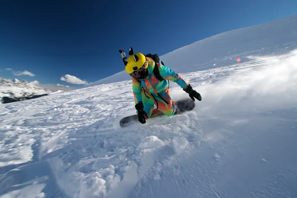 Funny snowboarder makes turn