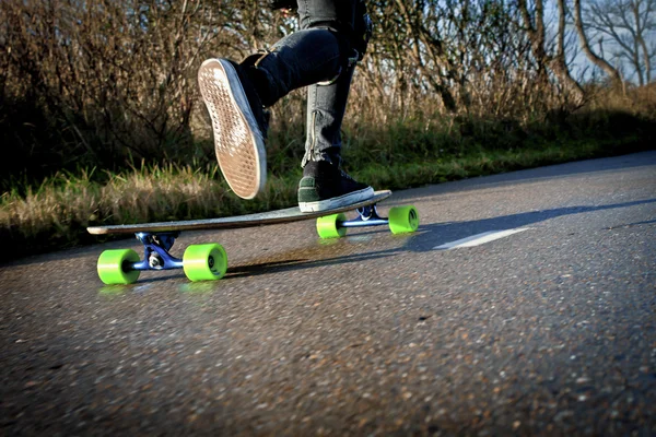 Stepping forward on a skateboard