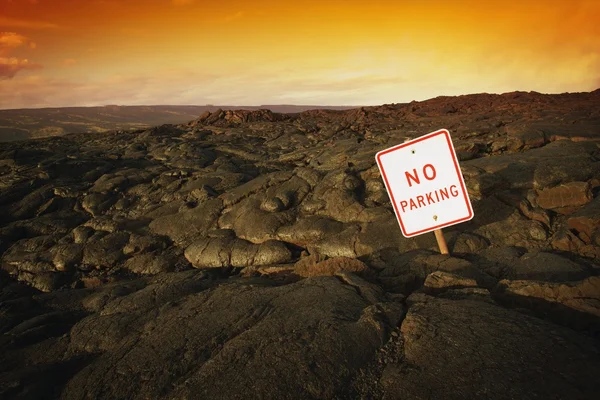 No Parking Sign On Volcanic Rock