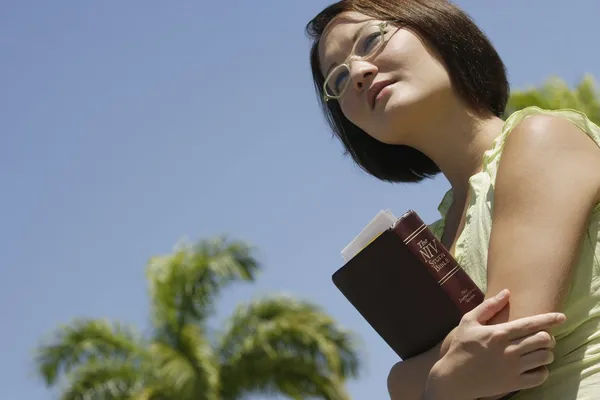 Female Student Carrying Her Study Bible