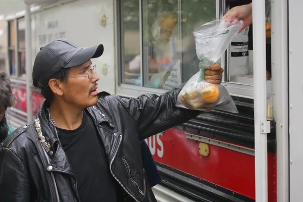 Food Being Given To A Man