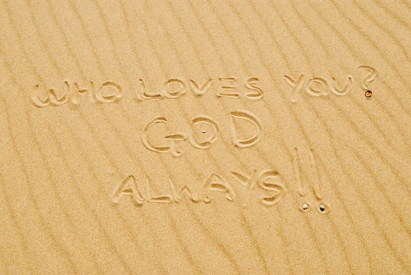 Writing In Sand That States, Who Loves You? God, Always