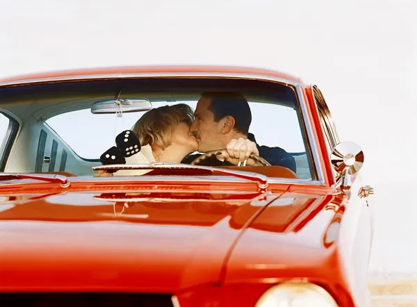 Couple Kissing In Antique Car