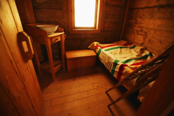 Old-Fashioned Room With Hudson's Bay Company Blanket, Snowshoes And Washing Basin