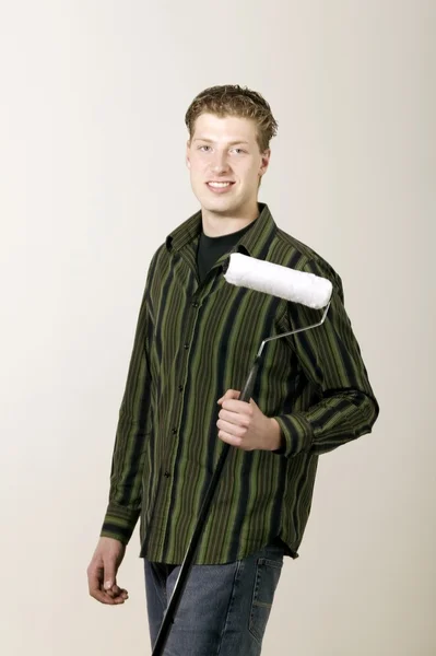 Man Posing With Paint Roller