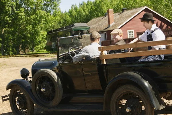 Men In A Vintage Car