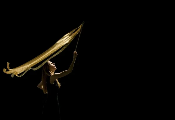 Woman Waving Flag In Black Background