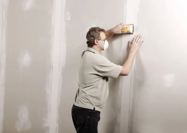 Man Using A Sander