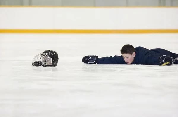 Hockey Player Who Has Fallen On The Ice