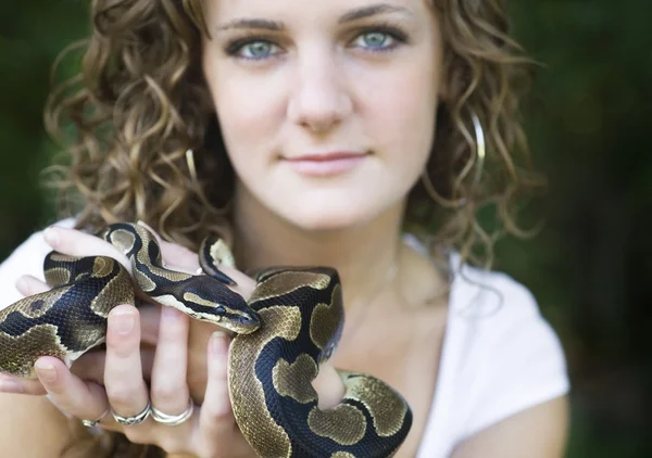 Woman holding a snake