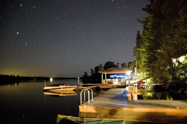 Cottage dock lit up at night
