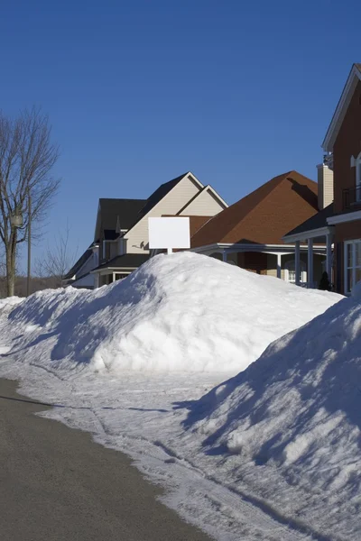 Snow Piled On Edge Of Street