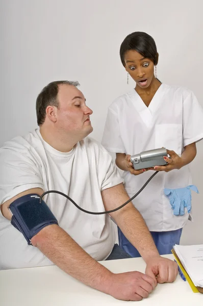 Nurse Unhappy With Overweight Man Eating Cake