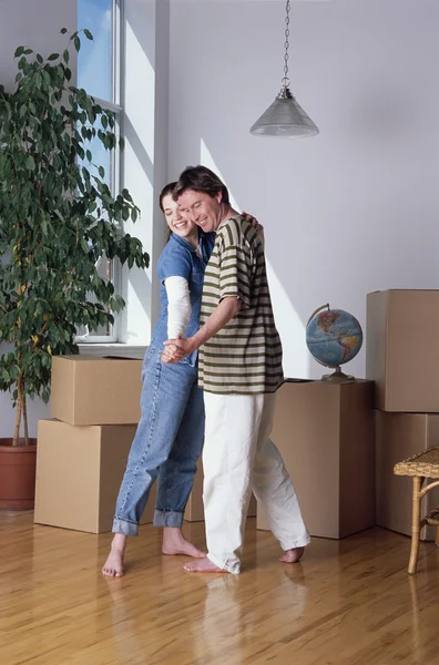 Couple Dancing In New Home