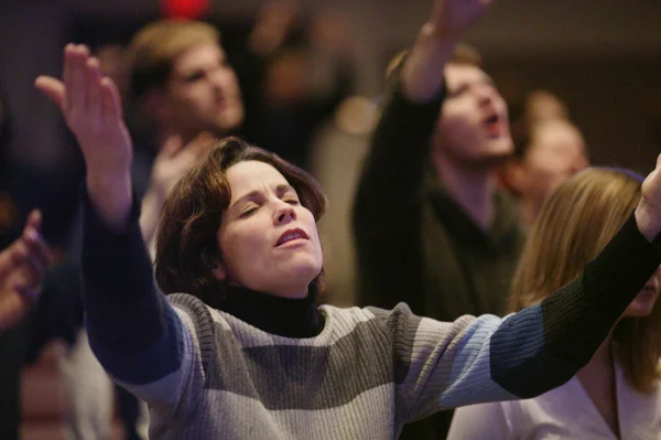 Woman Raising Hands In Worship