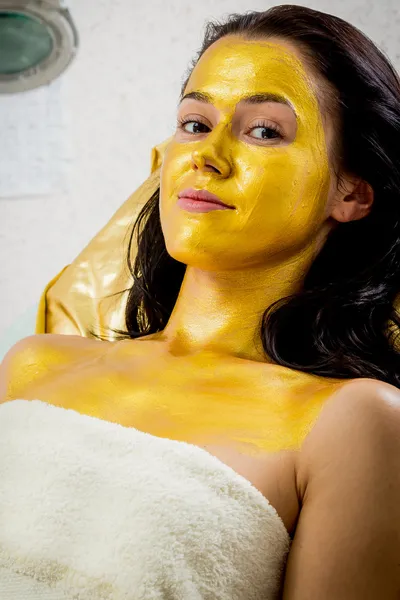 Woman in golden mask