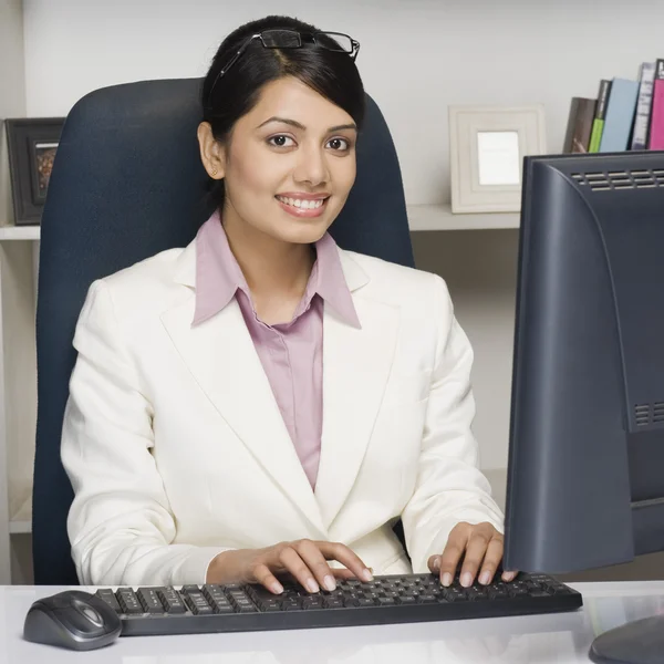 Businesswoman working on a desktop