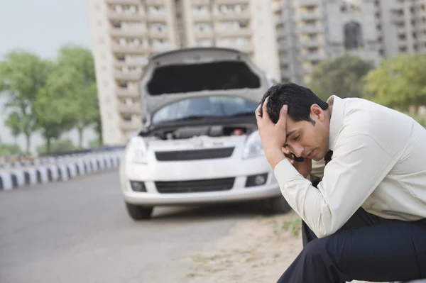 Businessman after his vehicle breakdown