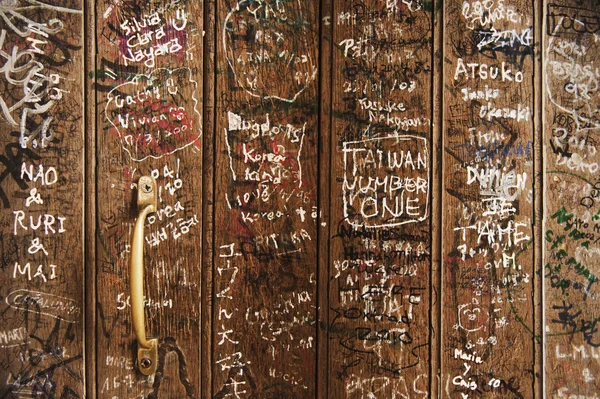 Graffiti covered door, Oxford University