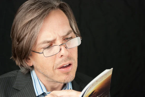 Casual Businessman Wearing Reading Glasses Reading Book