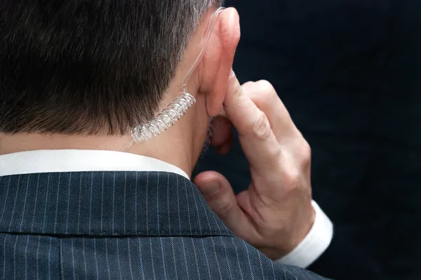 Secret Service Agent Listens To Earpiece, Behind