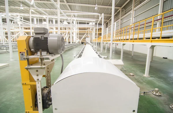 Factory equipment. Industrial conveyor line transporting package