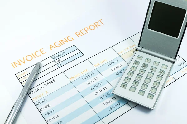 Invoice report with calculator and pen for business