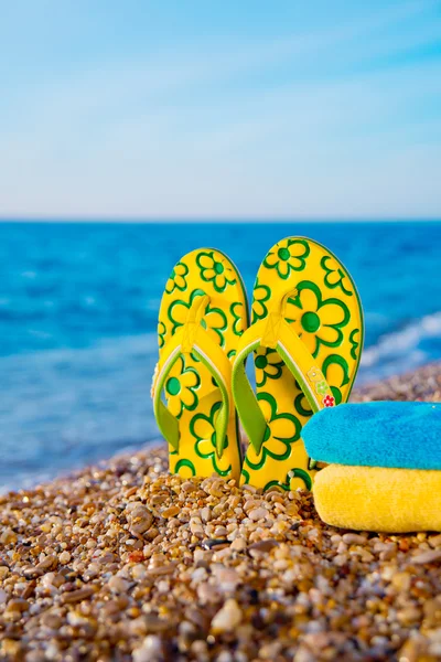 Things for the beach towel, sunscreen, flip flops